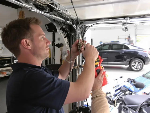 Lakeville Garage Door Repair safety certified technician performing cable replacement in Lakeville