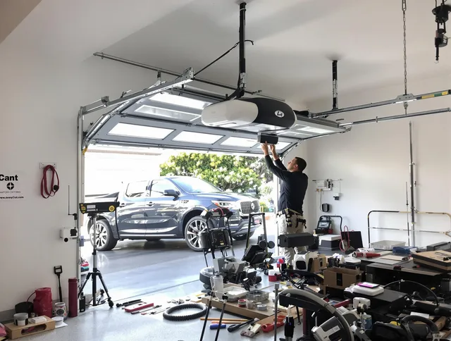 Lakeville Garage Door Repair specialist installing smart garage door opener system in Lakeville home