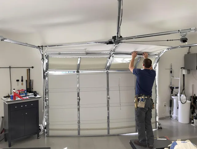 Lakeville Garage Door Repair specialist performing precise section replacement on Lakeville garage door